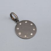 A DIAMOND SET SILVER PENDANT.