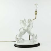 A REARING WHITE STALLION CERAMIC LAMP.