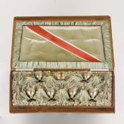 A EARLY 20TH CENTURY CASED SET OF AUSTRIAN-HUNGARIAN .800 SILVER-GILT EGG CUPS.