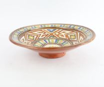 A LARGE TERRACOTTA FOOTED BOWL.