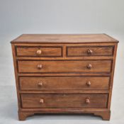 GEORGE III OAK AND MAHOGANY BANDED CHEST.