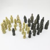 A COLLECTION OF 32 RESIN CHESS PIECES.