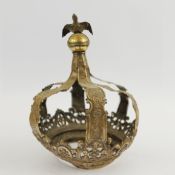 A WHITE METAL CROWN.