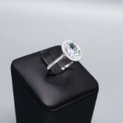 A PLATINUM AQUAMARINE AND DIAMOND DRESS RING.