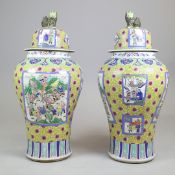 PAIR OF CHINESE FAMILLE ROSE STYLE CERAMIC LIDDED TEMPLE JARS.
