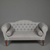 SMALL SOFA WITH BUTTONED BACK LINEN UPHOLSTERY ON TURNED SUPPORTS.
