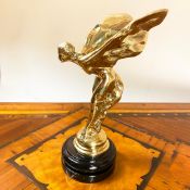 GILT METAL SPIRIT OF ECSTASY FIGURE ON A MARBLE BASE.