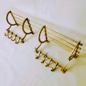 PAIR OF GILT METAL WALL HANGING LUGGAGE RACKS WITH COAT HANGERS.