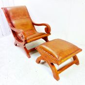 LEATHER AND TEAR SCROLLED ARMCHAIR AND FOOTSTOOL.