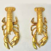 PAIR OF WALL HANGING LOBSTERS IN A GILT FINISH.