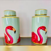 PAIR OF LIDDED CERAMIC JARS WITH FLAMINGO DECORATION.