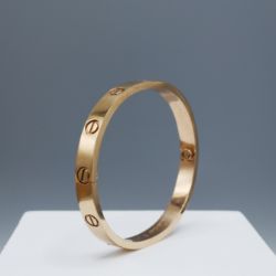 A CARTIER LOVE BRACELET.