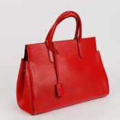 A LOUIS VUITTON 'MARLY' RED EPI LEATHER HANDBAG.