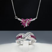 A STERLING SILVER RUBY SET NECKLACE AND A RUBY RING.