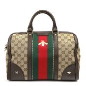 A GUCCI MONOGRAM BOSTON BAG.
