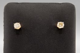A PAIR OF DIAMOND SOLITAIRE STUD EARRINGS.