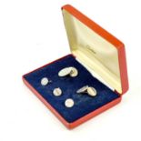 A CARTIER SILVER CUFFLINKS SET