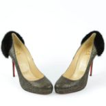 A PAIR CHRISTIAN LOUBOUTIN PUMPS.