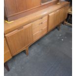 TEAK MID CENTURY SIDEBOARD WITH DRINKS CABINET SECTION (69½" LONG)