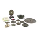 GROUP OF TEN CHINESE BRONZE MIRRORS WITH A COIN AND A BOWL