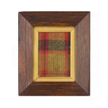 AN 18TH CENTURY FRAMED PIECE OF TARTAN