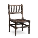 A SCOTTISH VERNACULAR OAK BOBBIN CHAIR