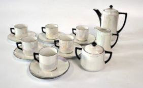 A German opalescent coffee set comprising of six cups and seven saucers, coffee pot, cream jug and