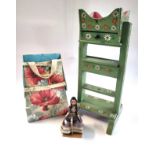 A lace maker's table, cushion and doll