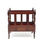 A Regency mahogany Canterbury with three compartments a single drawer, turned legs and brass castors