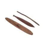 An Australian Aboriginal hardwood woomera 60cm an Aboriginal wunda shield 11cm x 75cm and a throwing