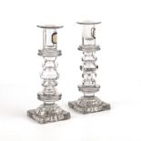 A pair of Georgian glass candlesticks with knopped stems and square bases 19cm high Chips to bases