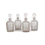 A set of four Georgian glass decanters with hand cut floral decoration each 22cm high Good with