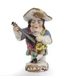An 18th century Chelsea style porcelain figurine of a mansion house dwarf playing a mandolin 20cm