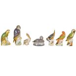 A collection of seven Royal Crown Derby porcelain paperweights in the form of birds including a