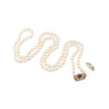 A cultured pearl necklace and a cultured pearl and diamond ring, the uniform strand of cultured