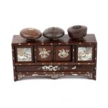 A 19th century Chinese, blackwood and mother of pearl bowl stand of side cabinet form with four