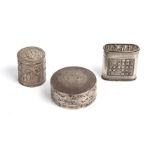 Three late 19th century Chinese opium boxes to include a silver box with characters, the top
