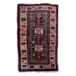 A green ground Kazak, Caucasus, all wool. Late 19th c. (231cm x 136cm) Snall repairs and wear to