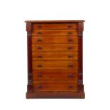 A Victorian Army and Navy mahogany collector's cabinet of eight drawers with knob handles behind