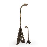 Two early 20th century Indonesian dragon floor lamps with gilded decoration the largest 180cm