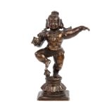 A 19th century Indian figure of dancing Krishna, 12cm high