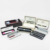 A collection of pens, to include Parker Duofold, some with 14 carat gold nibs, various designs and