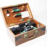 A surveyor's level, by Cooke, Troughton & Simms, in a wooden case 29w x 18d x 14h cm