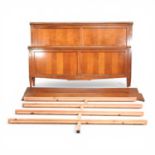 A French style cherrywood double bedstead, by And So To Bed, with gilt metal decoration and a wooden