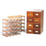 An early 20th century filing chest, together with two wine racks 44cm high (3)