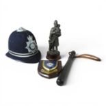 A Metropolitan police hat, together with a wooden truncheon, a Ministry of Defence shield and a