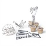 A pair of hay racks, together with a log basket, hanging brackets, a plant stand and wicker baskets