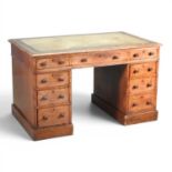 A Victorian oak pedestal desk, with an inset top, on a plinth base 122w x 73d x 74h cm