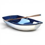 A royal blue and white fibreglass rowing boat, by Moores of Oxford & Wroxham, with a pair of