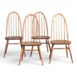 A set of four 1970s Ercol Quaker stick back dining chairs, on splayed legs (4) Overall condition